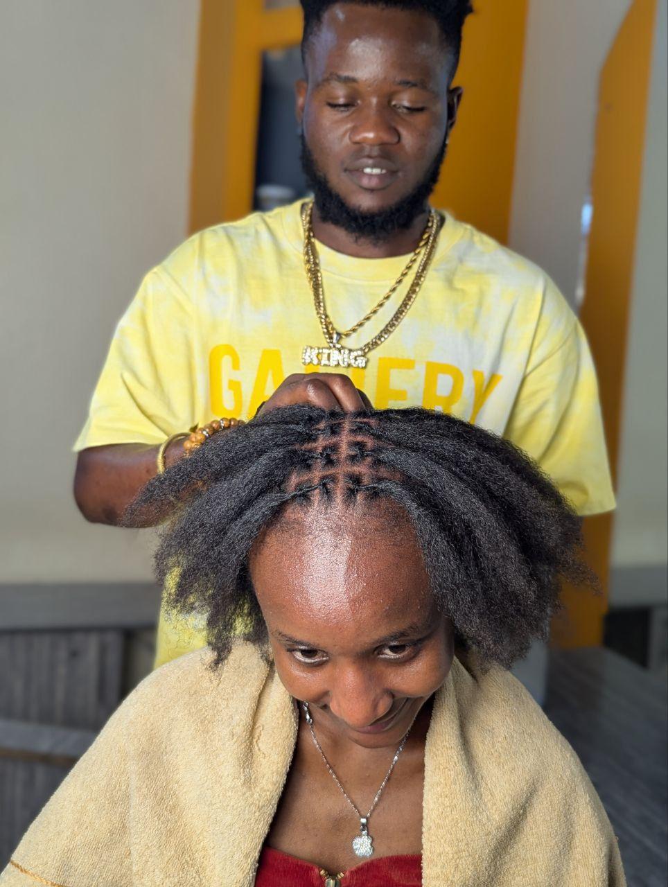 Human hair loc installation by Jacob Locs
